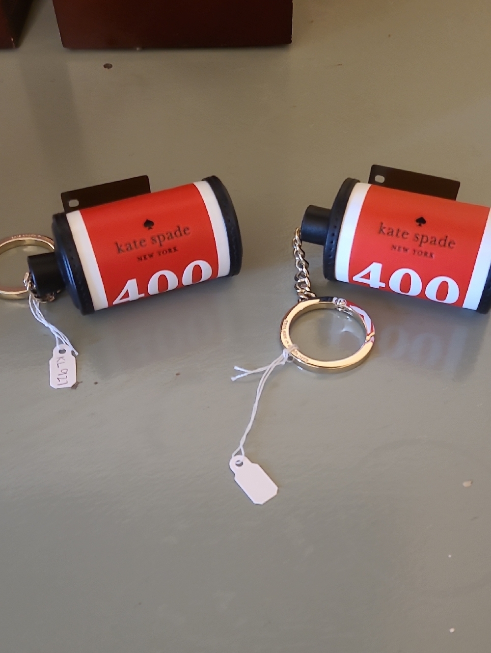 kate spade red and white film roll keychain/purse charm